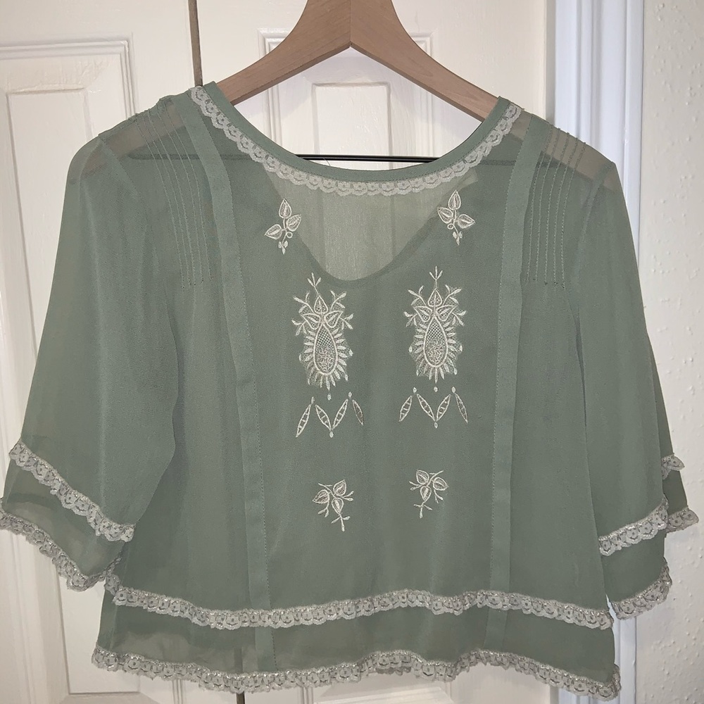 URBAN OUTFITTERS:  Beautiful color Bell sleeve top